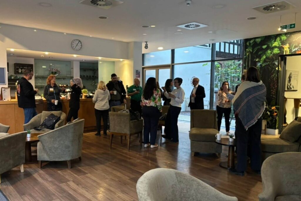Visitors and members networking over coffee
