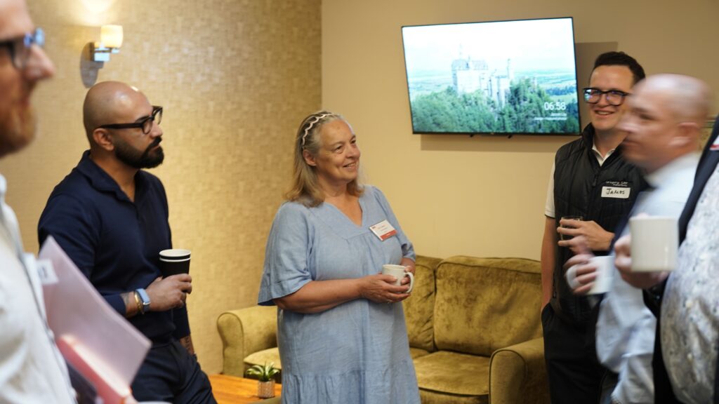 Visitors and members networking over coffee